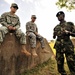 U.S. Soldiers Attached to Combined Joint Task Force-Horn of Africa Talk to a Uganda Peoples Defense Force Soldier in Jinja.