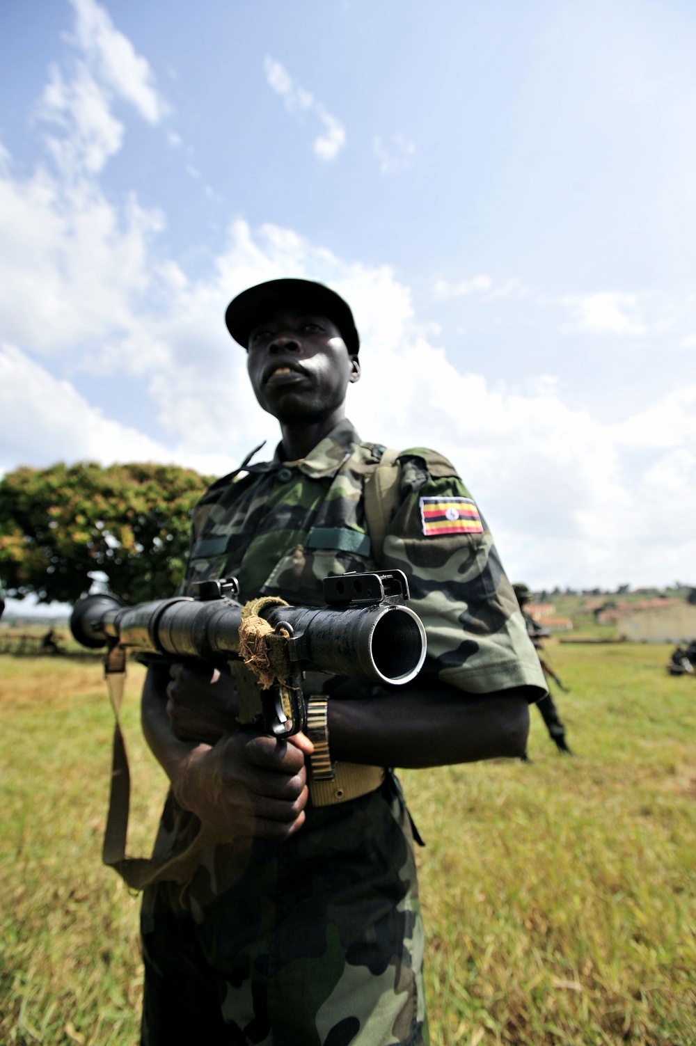 A Uganda Peoples Defense Force Soldier Stands in a Field During a Demonstration of Skills Learned During the UPDF Non-Commissioned Officers Academy in Jinja.