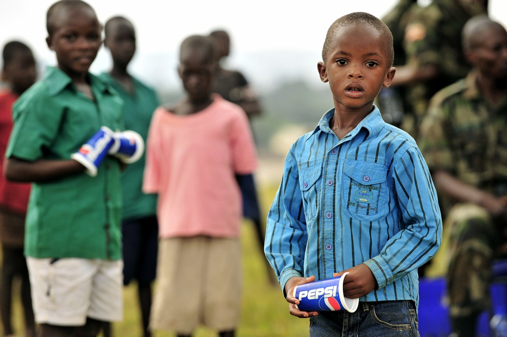 Children of Uganda Peoples Defense Force Soldiers Stand Watching a Graduation Ceremony at the UPDF Non-Commissioned Officers Academy in Jinja.