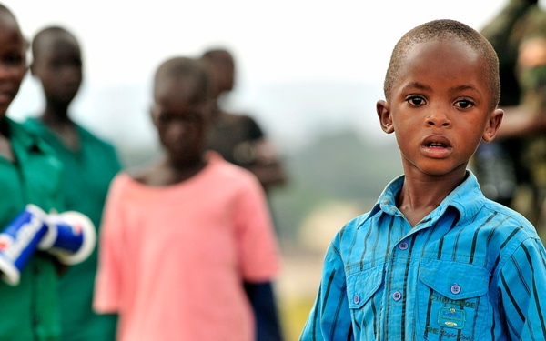 Children of Uganda Peoples Defense Force Soldiers Stand Watching a Graduation Ceremony at the UPDF Non-Commissioned Officers Academy in Jinja.