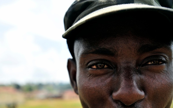 A Uganda Peoples Defense Force Soldier Smokes a Cigarette After a Demonstration of Skills Learned During the UPDF Non-Commissioned Officers Academy in Jinja.