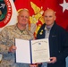Civilian journalist receives Navy's second highest honor