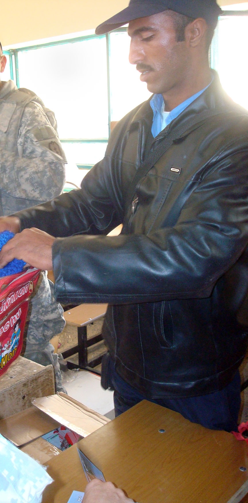 Strykehorse Soldiers, Iraqi Police bring supplies, joy to students