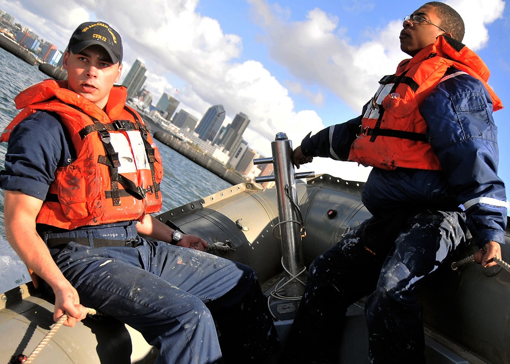 Sailors perform preventive maintenance on USS Abraham Lincoln