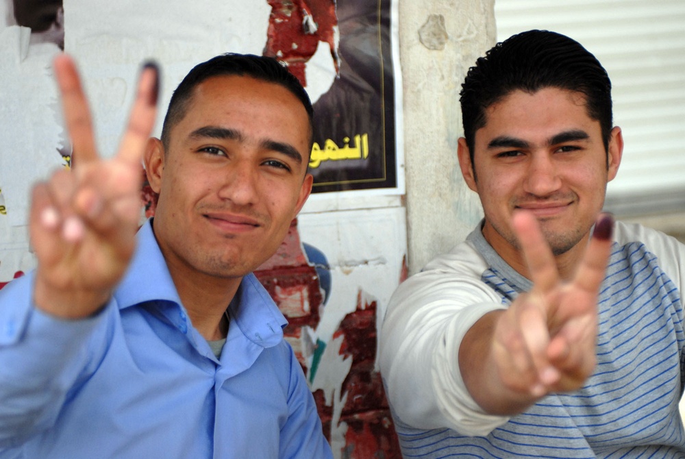 Iraqis vote while Striker Soldiers show support