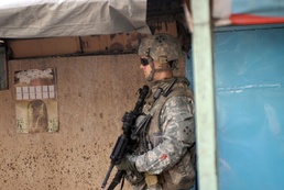 Iraqis vote while Striker Soldiers show support