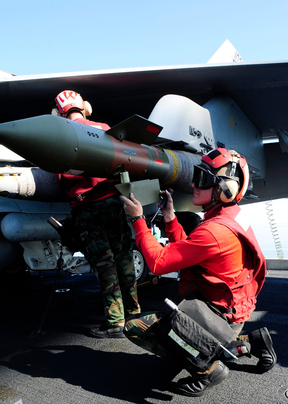 Ordnance unload aboard USS Theodore Roosevelt