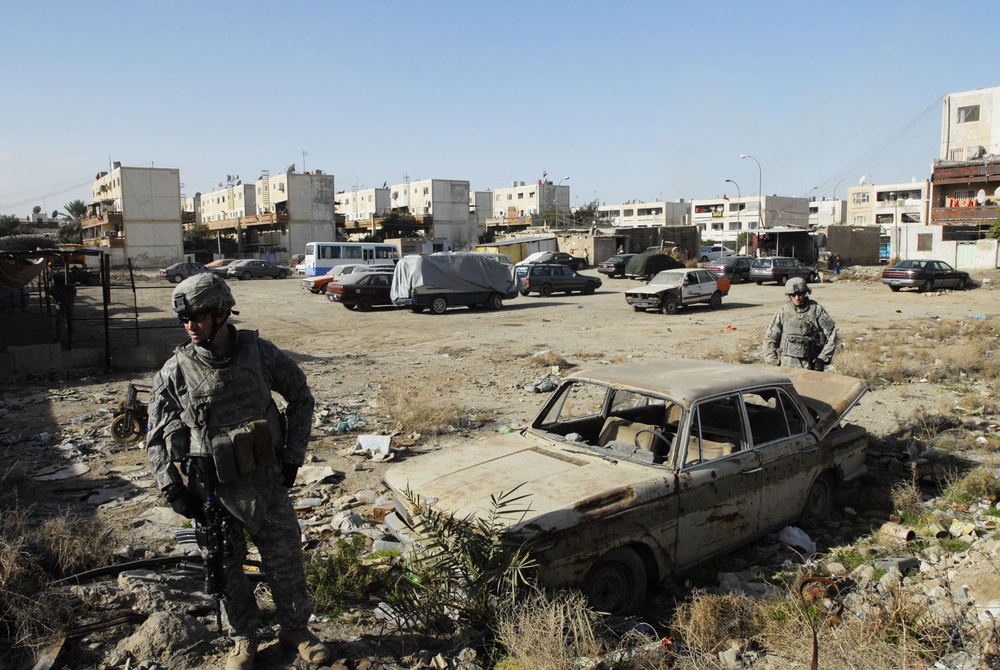Comanche Troop Soldiers patrol Saha apartments
