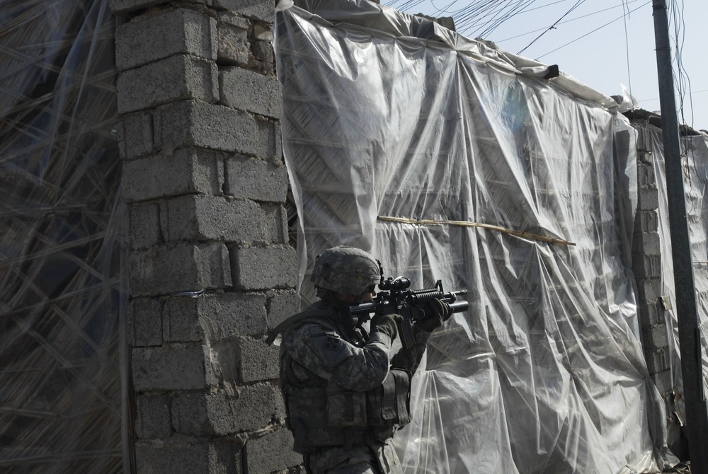Comanche Troop Soldiers patrol Saha apartments