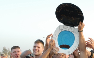 Guard Non-commissioned Officers Raise 'trophy' Following Flag-football Game Vs. Officers