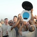 Guard Non-commissioned Officers Raise 'trophy' Following Flag-football Game Vs. Officers