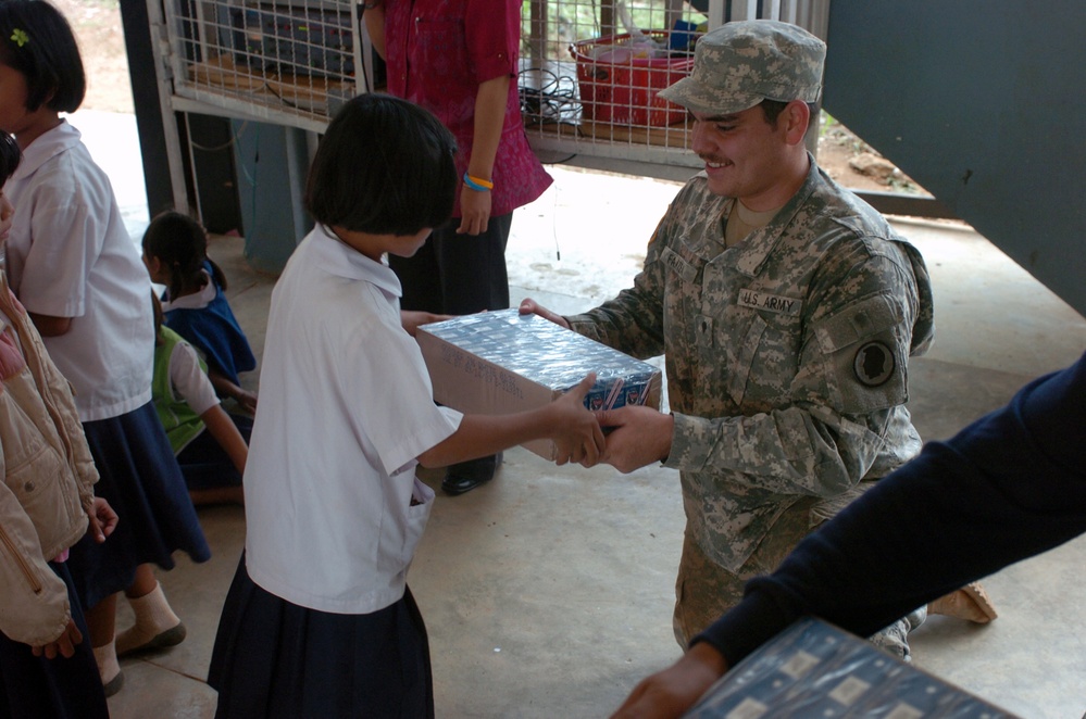 Hawaii Soldiers, Thai Marines distribute 37,000 cartons of milk to schools, community