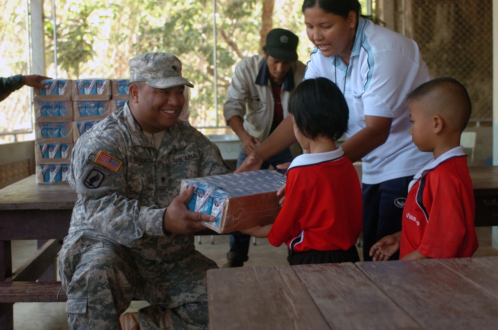 Hawaii Soldiers, Thai Marines distribute 37,000 cartons of milk to schools, community