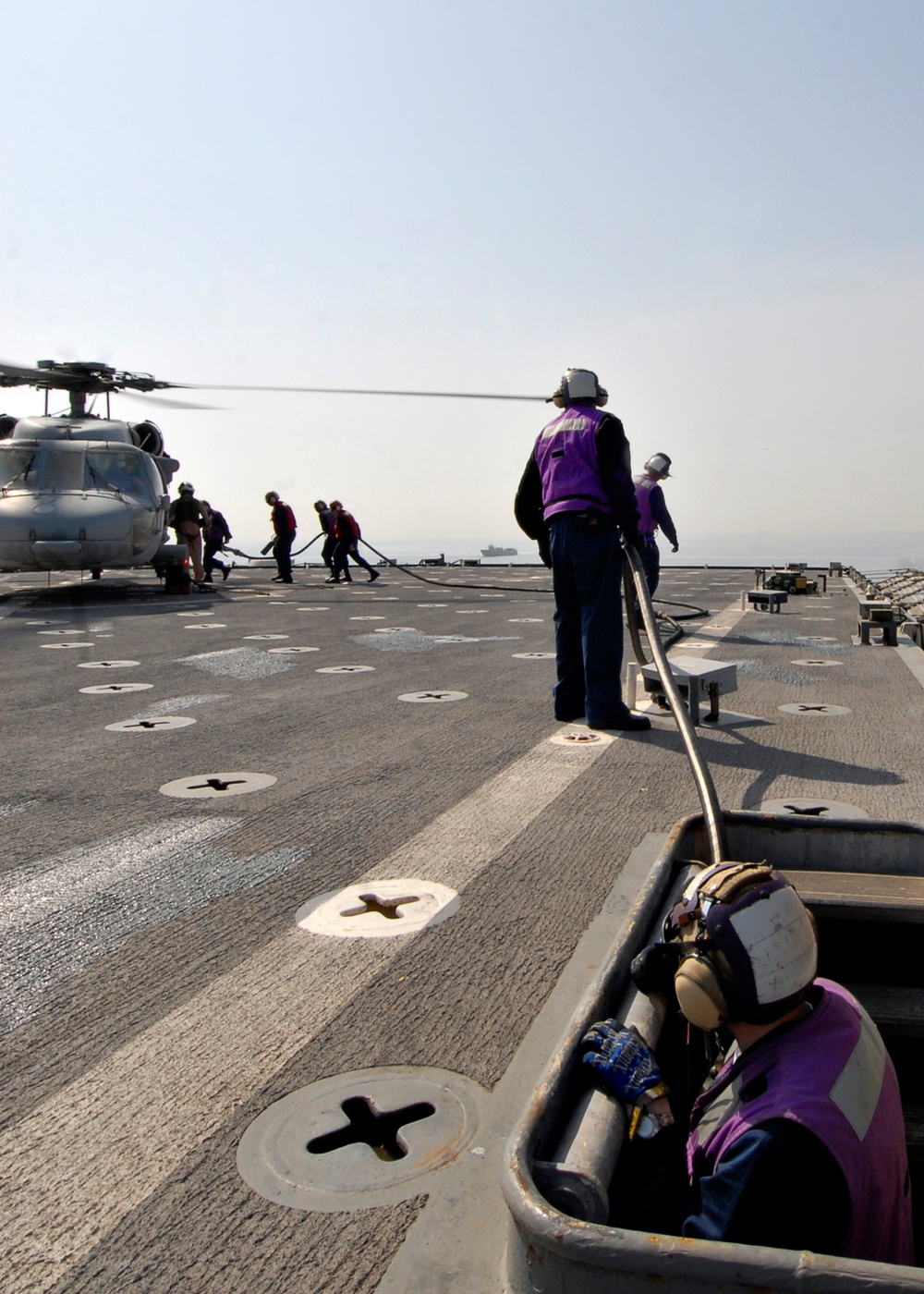 USS Carter Hall fuels helicopter