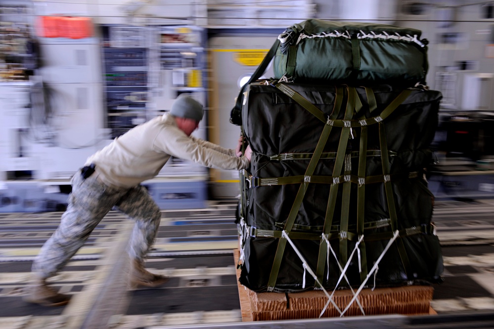 C-17 Airdrops Food, Water Over Afghanistan