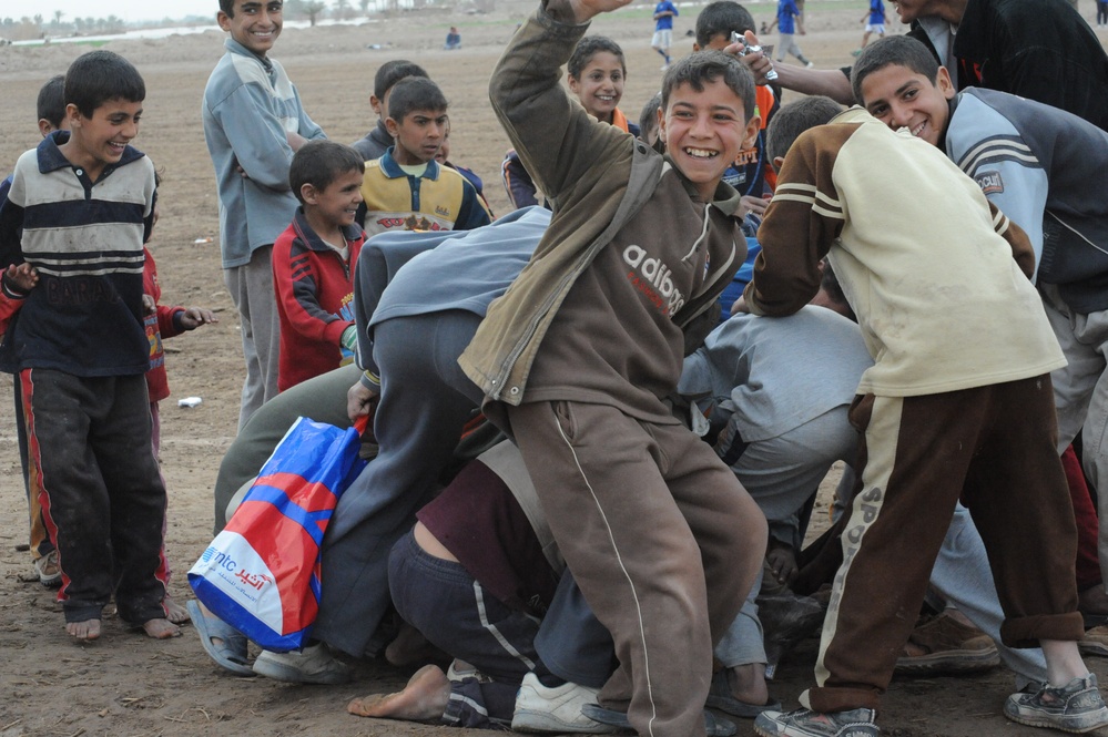 Soccer game on the outskirts of Mahmudiyah