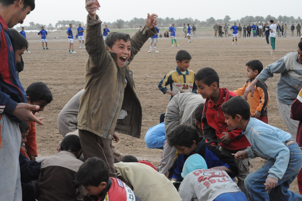 Soccer game on the outskirts of Mahmudiyah