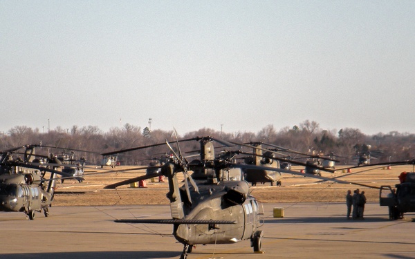 Apache, Chinook and Black Hawk formation on flight line