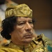 Muammar Gaddafi, leader of the Revolution of the Great Socialist People's Libyan Arab Jamahiriya, Sits Reading in the Plenary Hall of the United Nations (UN) Building in Addis Ababa, Ethiopia, During the 12th African Union (AU) Summit