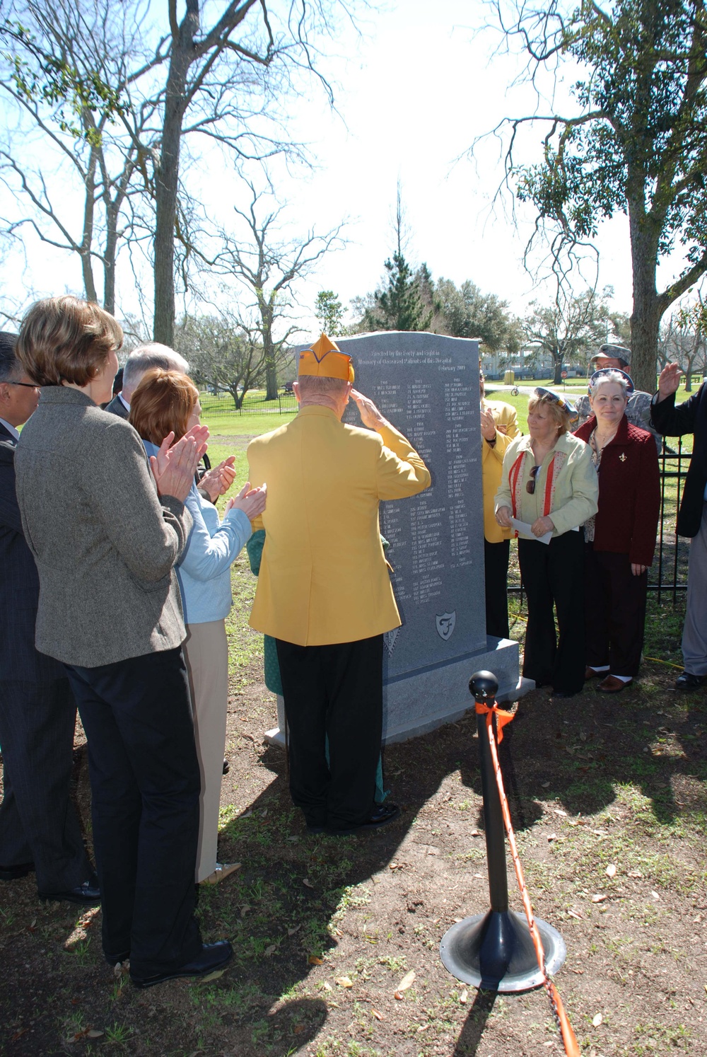 Ted D. Lang salutes an unveiled monument in the cemetery at the Louisiana National Guard's Gillis W. Long Center in Carville, La. The &quot;Forty and Eight&quot; Veteran's Honor Society held a dedication ceremony at the facility, Feb. 19. A large monument was unvei