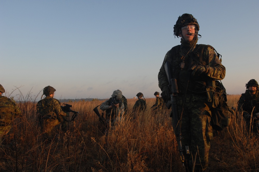 Canadian Forces Await Transport After Mission on Fort Pickett