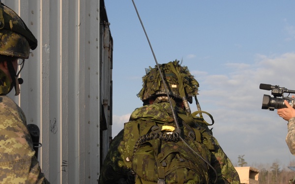Canadian Forces Await Transport After Mission on Fort Pickett