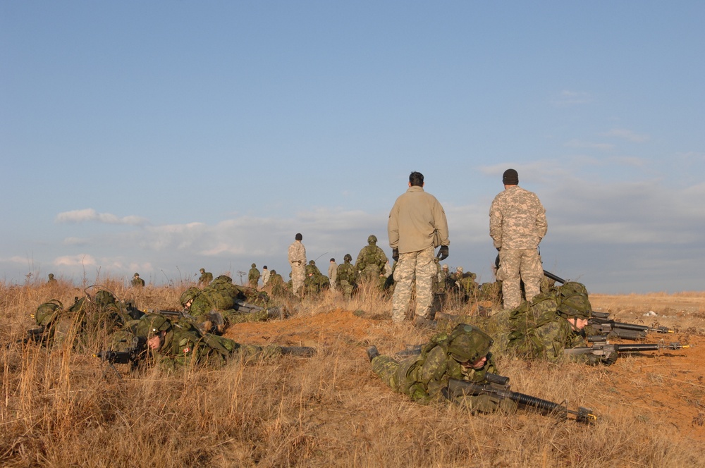 Canadian Forces Await Transport After Mission on Fort Pickett