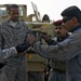 Coalition and Iraqi Army mechanics work to repair broken vehicles