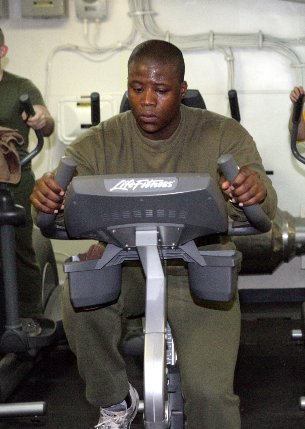 Marines and Sailors Work Out Aboard USS Bataan