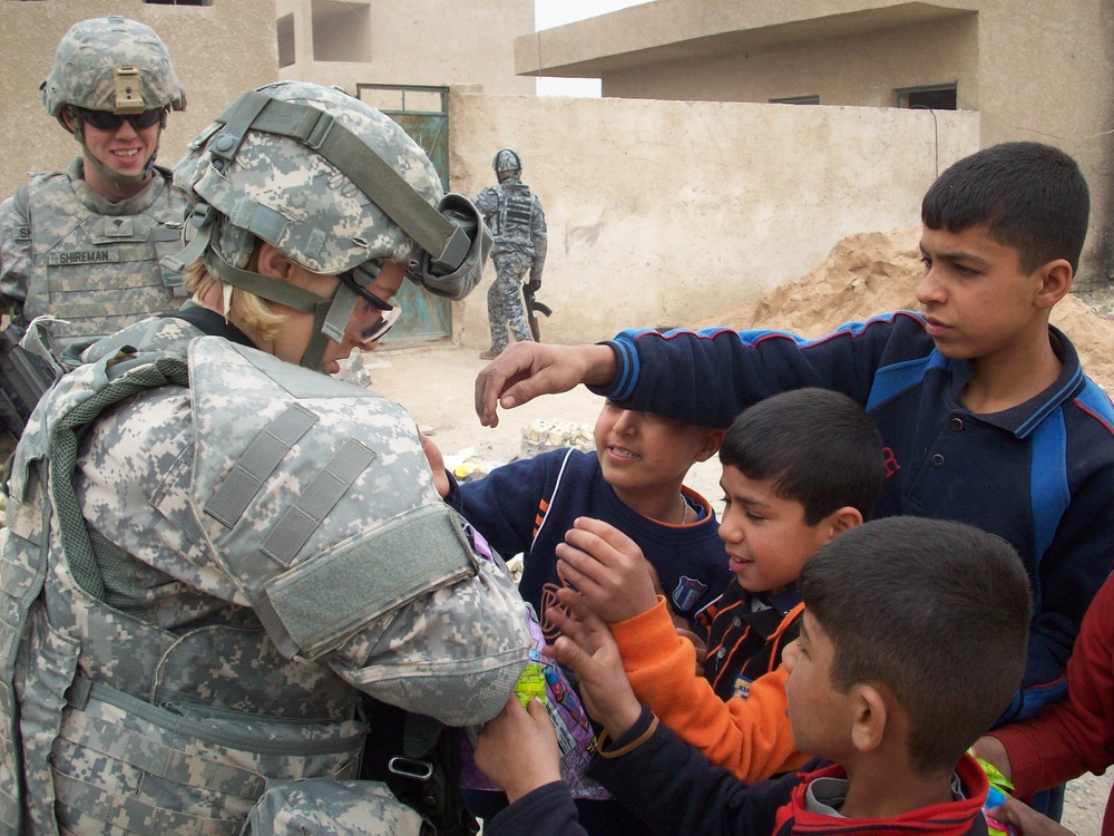 Indiana National Guard Transporters bring caring from home to school in Iraq