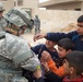 Indiana National Guard Transporters bring caring from home to school in Iraq