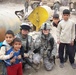 Indiana National Guard Transporters bring caring from home to school in Iraq