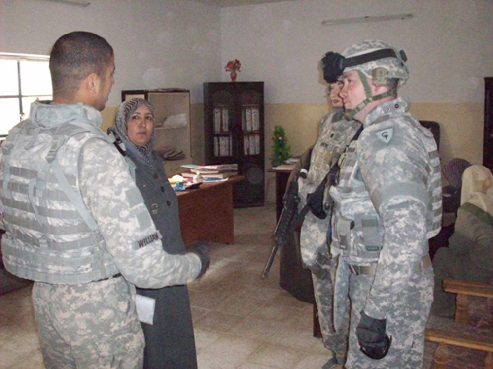 Indiana National Guard Transporters bring caring from home to school in Iraq