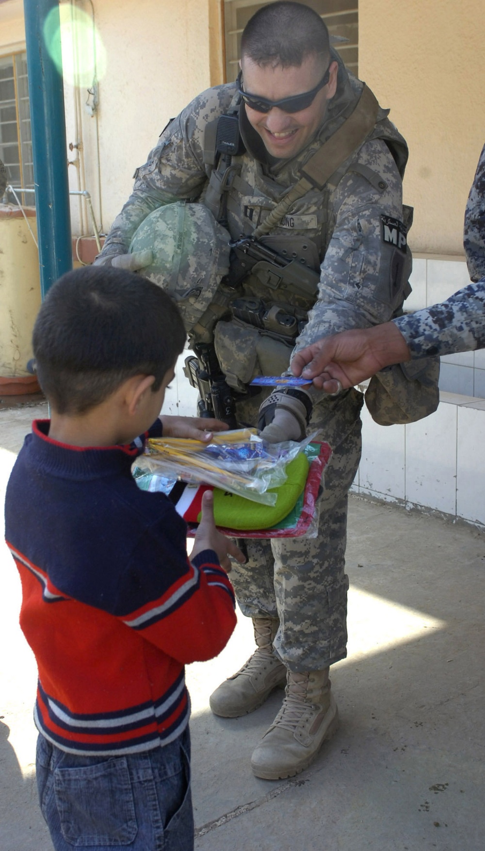 Iraqi Security Forces, Multi-National Division - Baghdad Soldiers distribute supplies to Karada schools