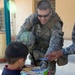 Iraqi Security Forces, Multi-National Division - Baghdad Soldiers distribute supplies to Karada schools