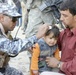 Iraqi Security Forces, Multi-National Division - Baghdad Soldiers distribute supplies to Karada schools