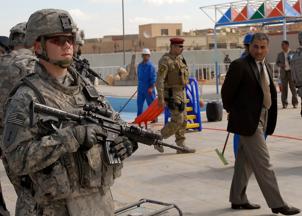 Returning a neighborhood - Joint Security Station Shulla transfer highlights security improvements