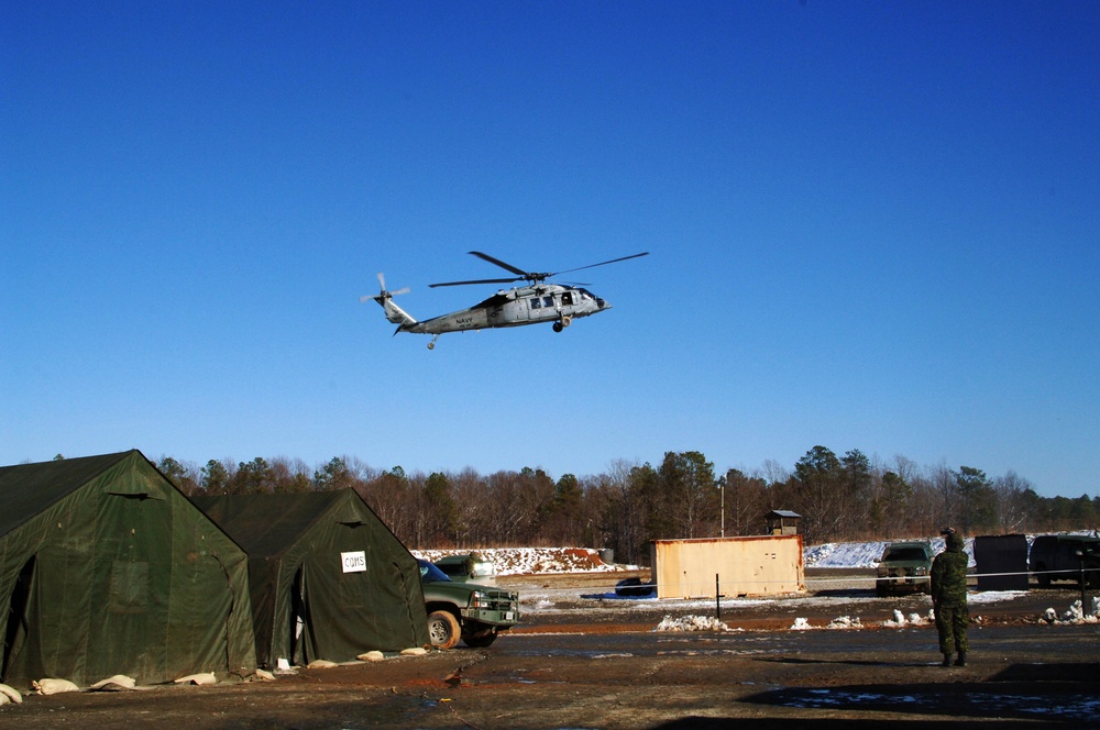 Soldiers Fly Over the Forward Operating Base During Exercise Maritime Raider 09