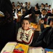 Iraqi police support local children