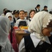 Iraqi police support local children