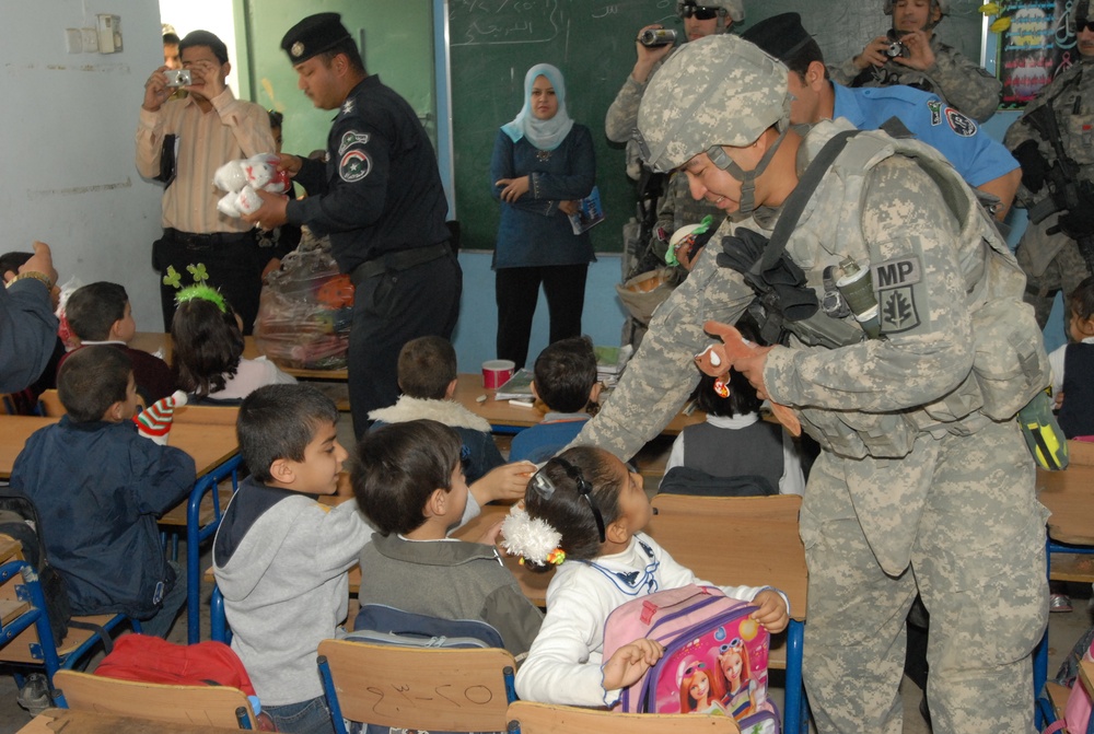 Iraqi police support local children
