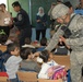 Iraqi police support local children