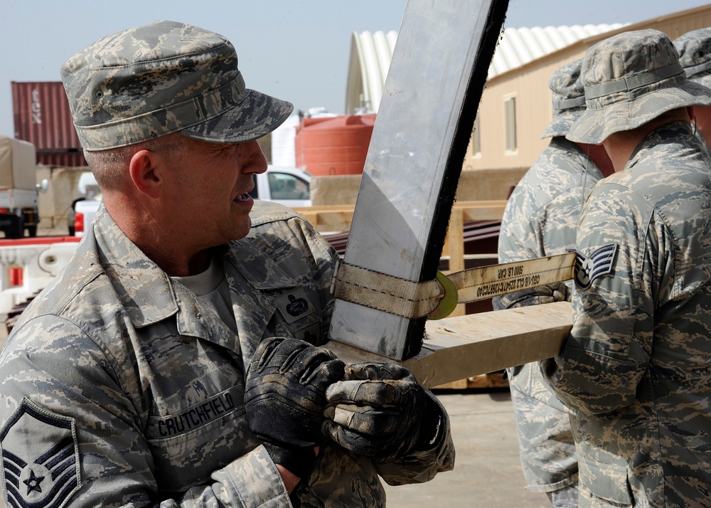 Airman work together to relocate tent