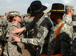 Wearing their wartime service on their sleeve: Multi-National Division-Baghdad troopers don First Team combat patch