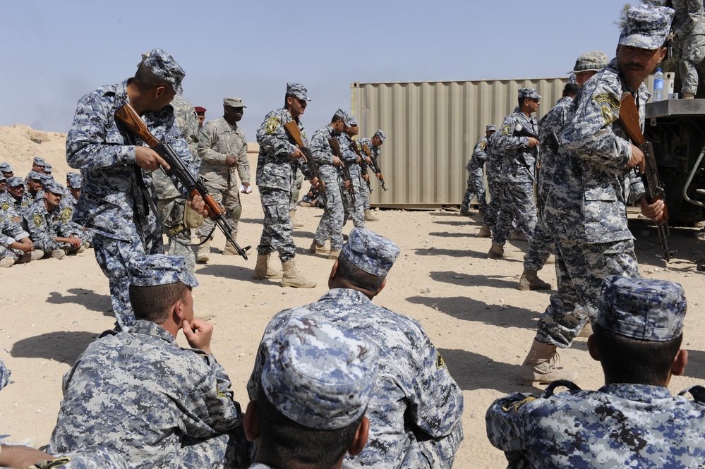 Iraqi national police officers train at headquarters in Rumaylah