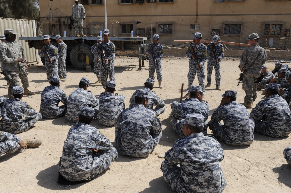 Iraqi national police officers train at headquarters in Rumaylah