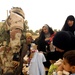 Iraqi army, Iron Brigade Soldiers give clothes, toys to widows in Arab Jabour