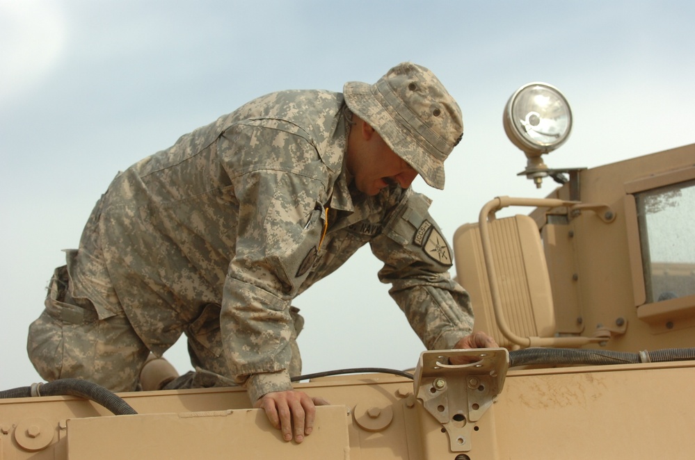 Soldiers Perform Routine Maintenance