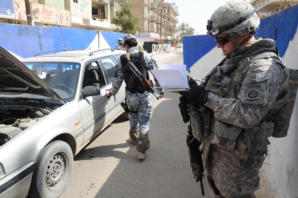 Artillery paratroopers conduct Iraqi Security Force checkpoint inspection