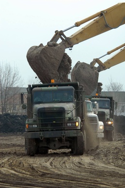 Deployment-hardened Soldiers, Airmen use familiar barriers to dam rising floodwaters